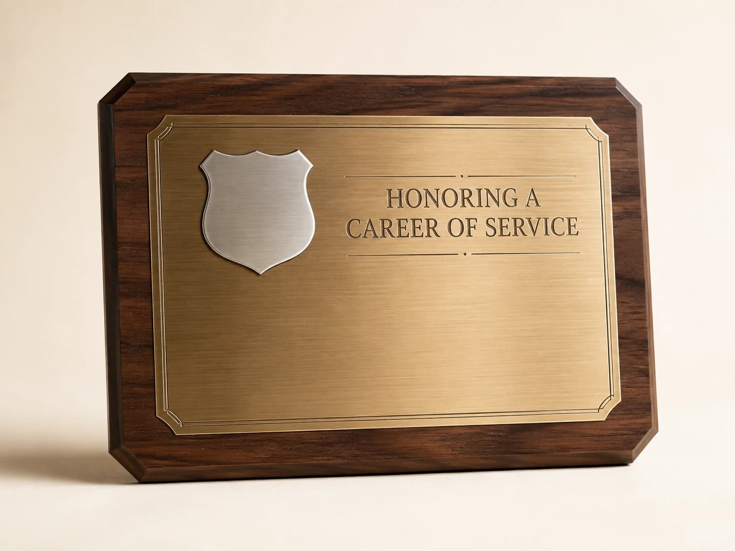 Walnut retirement plaque with a brass face and a plain nickel shield.